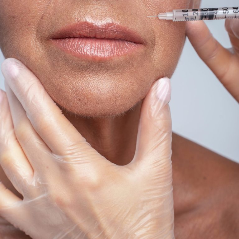 Sterile equipment. Senior lady visiting clinic while smoothing her wrinkles